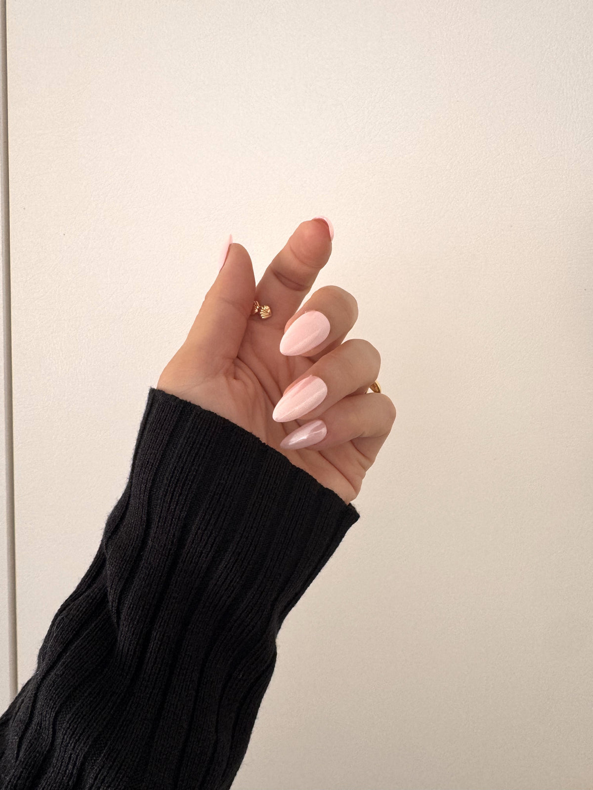 Aurora Pink glazed medium almond press on nails worn on hand