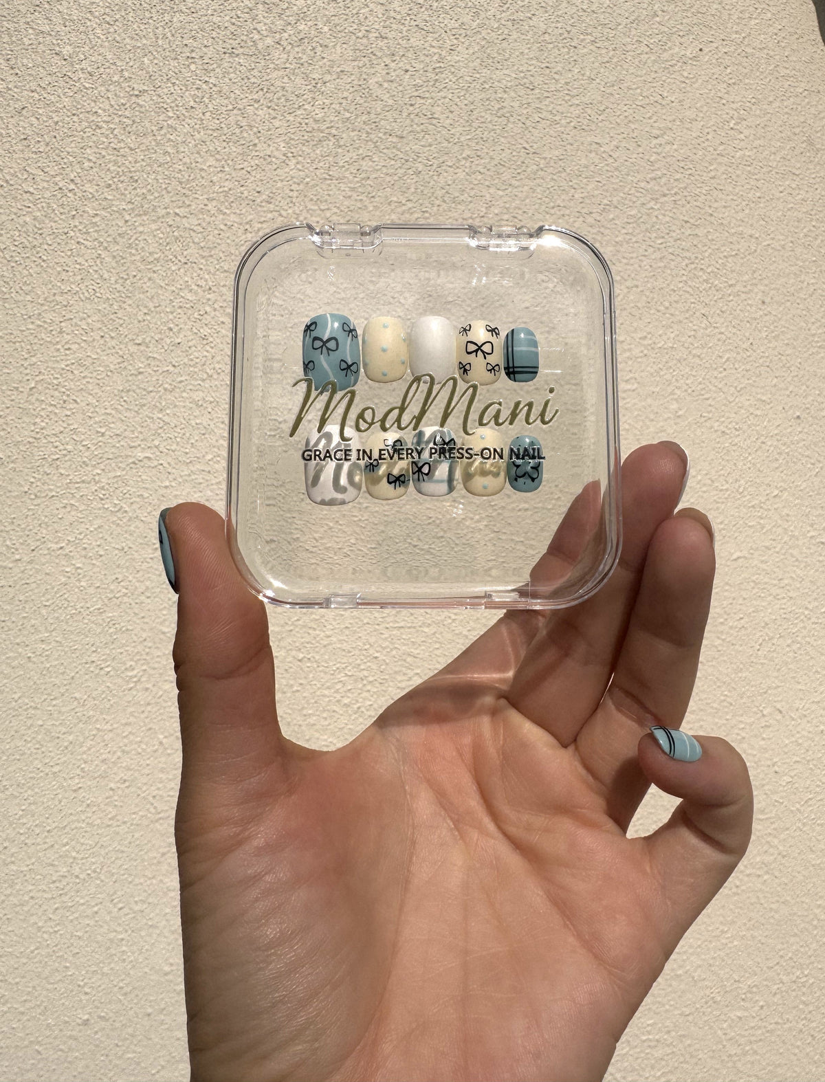 Petite Ribbon ModMani press-on nails held in natural Gold Coast sunlight