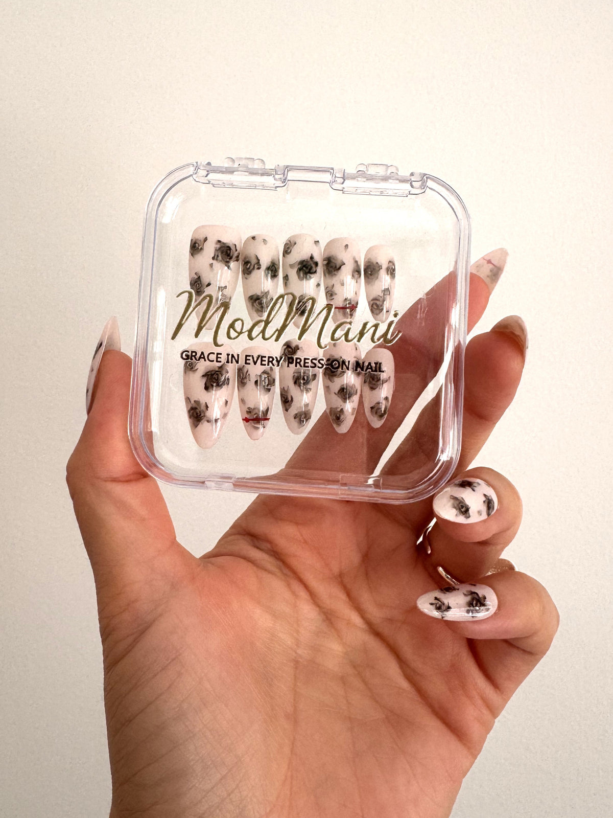 Noir Rose hand-painted floral press-on nails in ModMani clear case