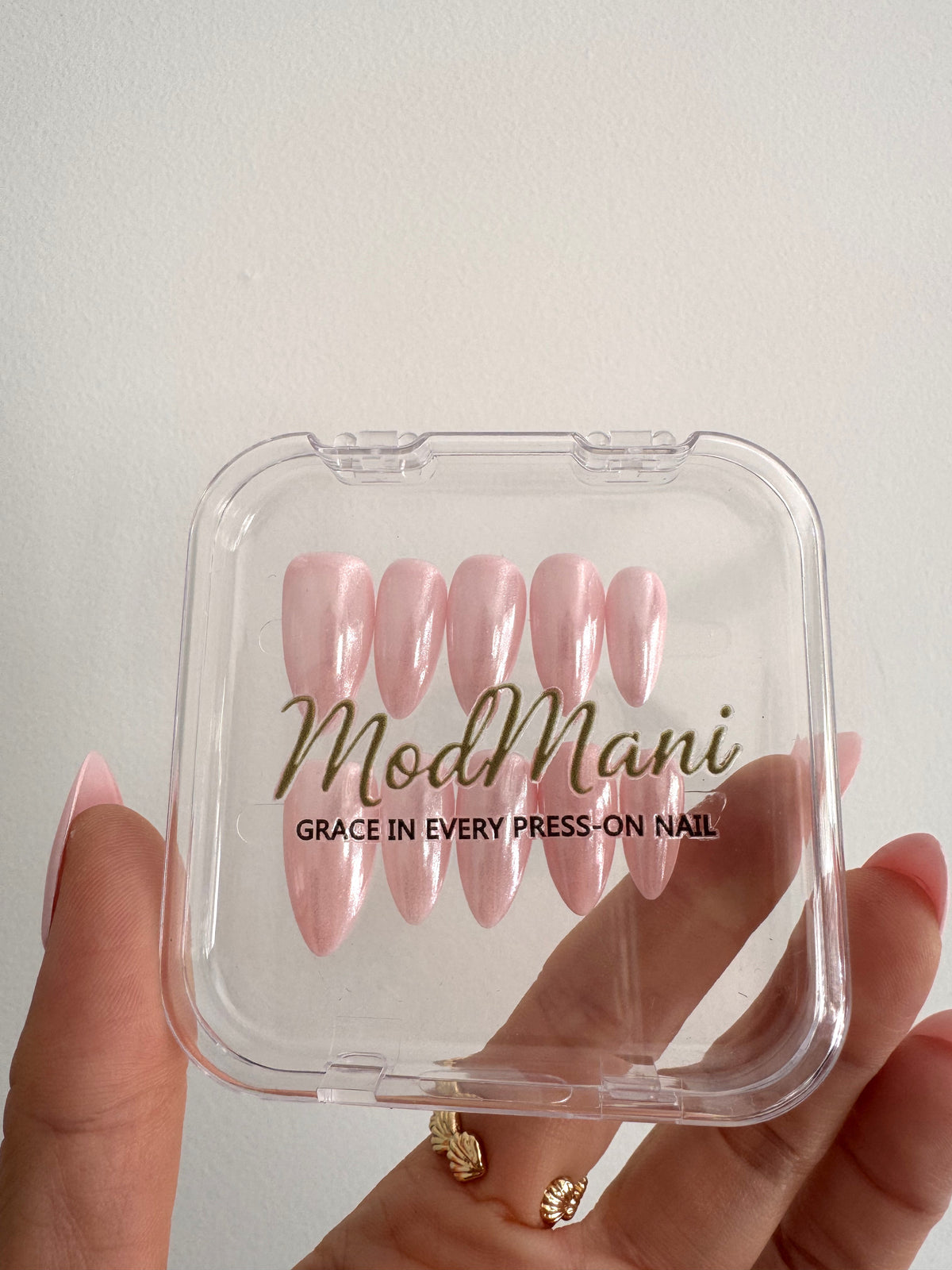 Aurora Pink pearly pink medium almond press on nails in ModMani case