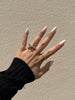 Aurora Pink pearly pink almond press on nails in sunlight