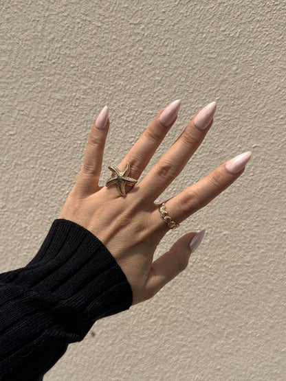 Aurora Pink pearly pink almond press on nails in sunlight
