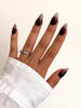 Cherry Mocha burgundy ombre Medium Almond press-on nails worn on hand