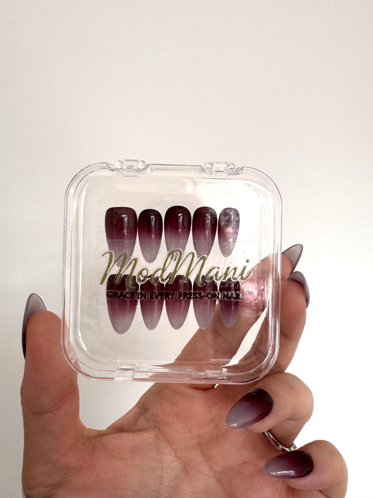 Cherry Mocha Medium Almond press-on nails in ModMani clear case