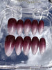 Close-up of Cherry Mocha glossy ombre Medium Almond press-on nail set