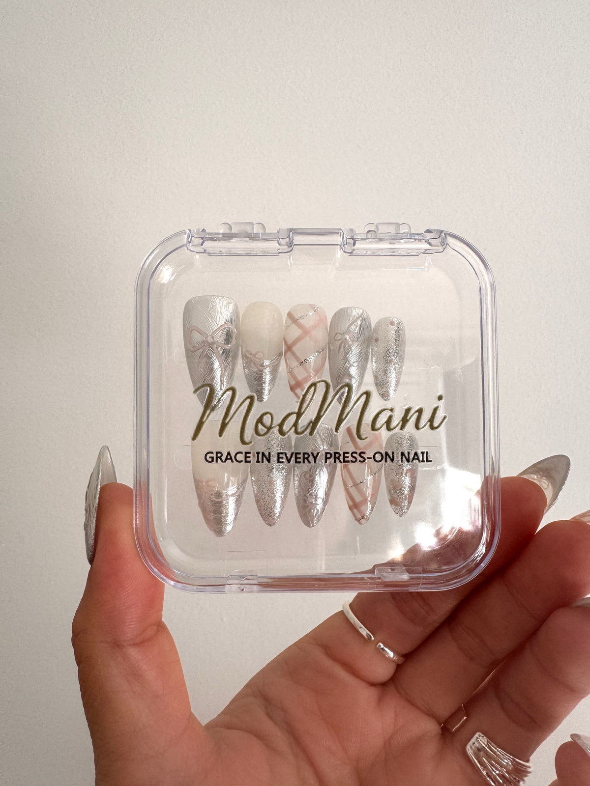 Chrome Ribbon silver and blush Medium Almond press-on nails in ModMani clear case