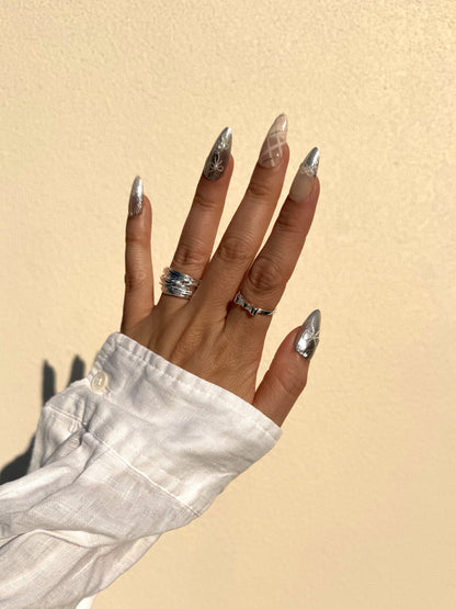 Chrome Ribbon silver chrome and blush pink Medium Almond press-on nails worn in sunlight