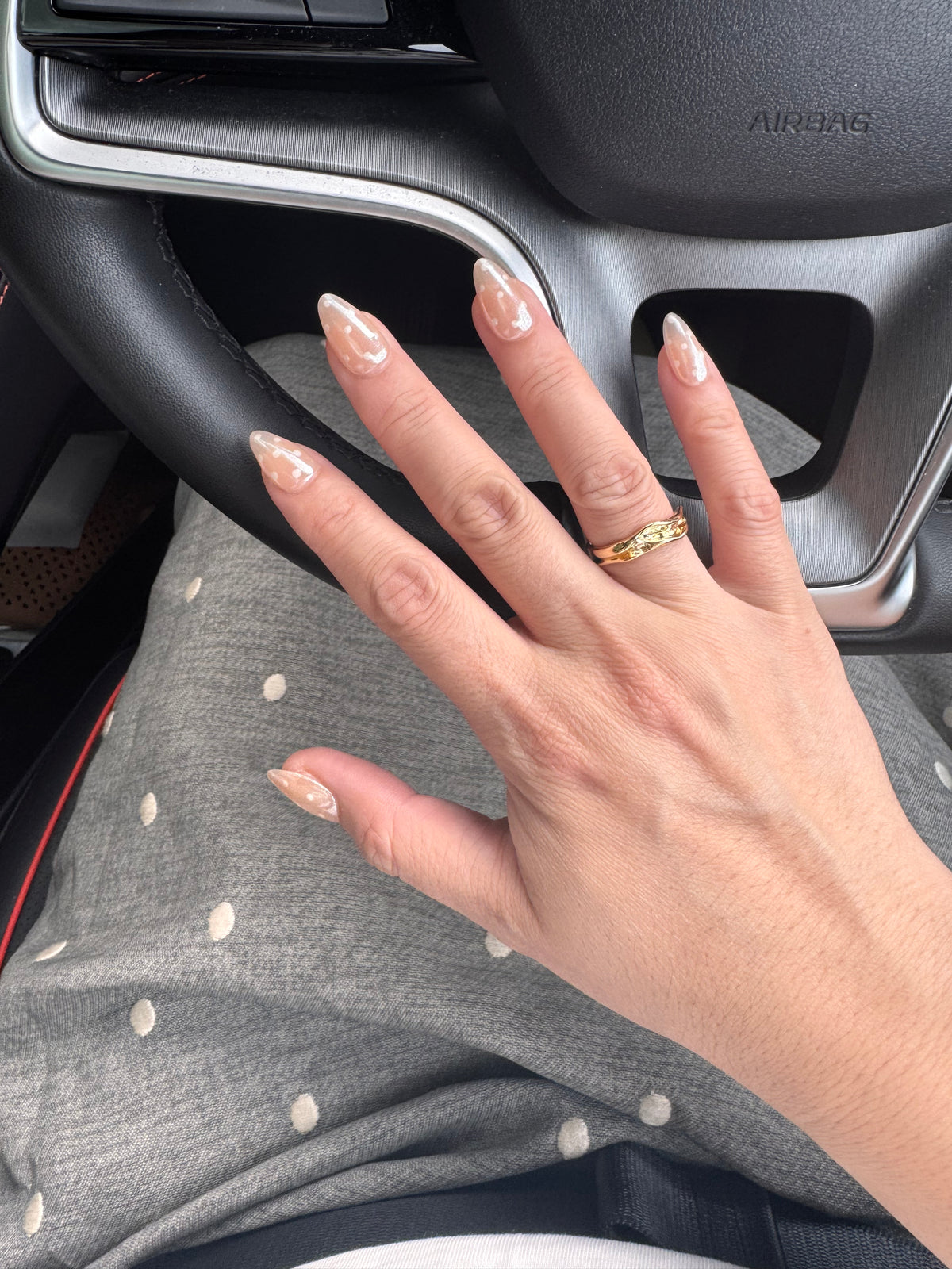 Glazed Dotty short almond press on nails worn on hand