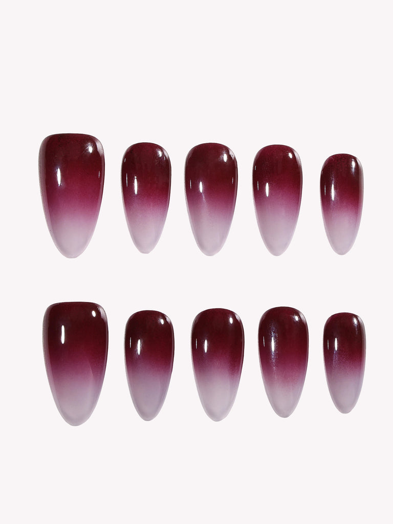 Close-up of Cherry Mocha glossy ombre Medium Almond press-on nail