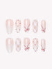 Coquette Berry pearly white Medium Oval press-on nails with berry red bows and argyle details