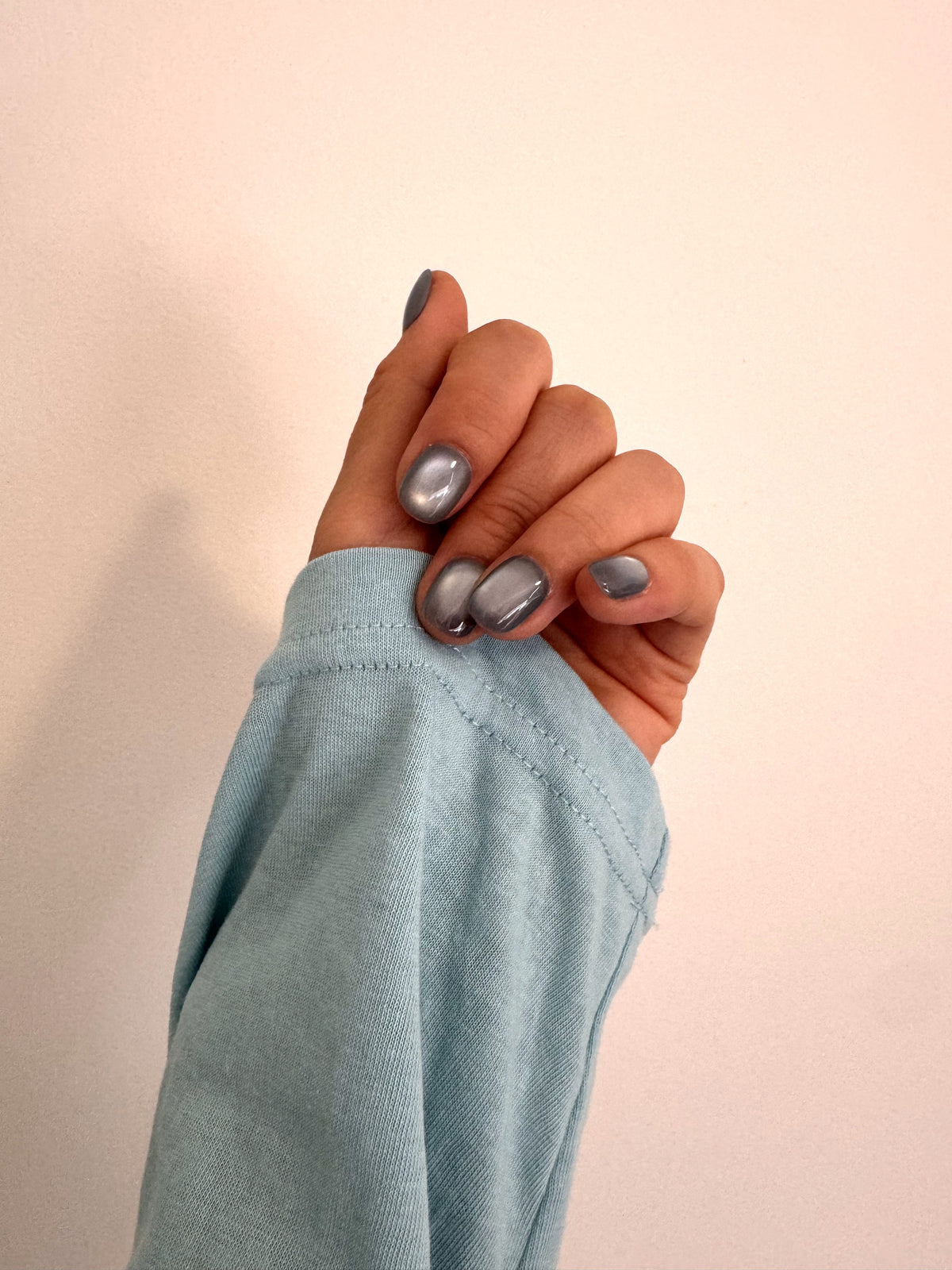Misty Ocean short squoval cat eye press on nails worn on hand