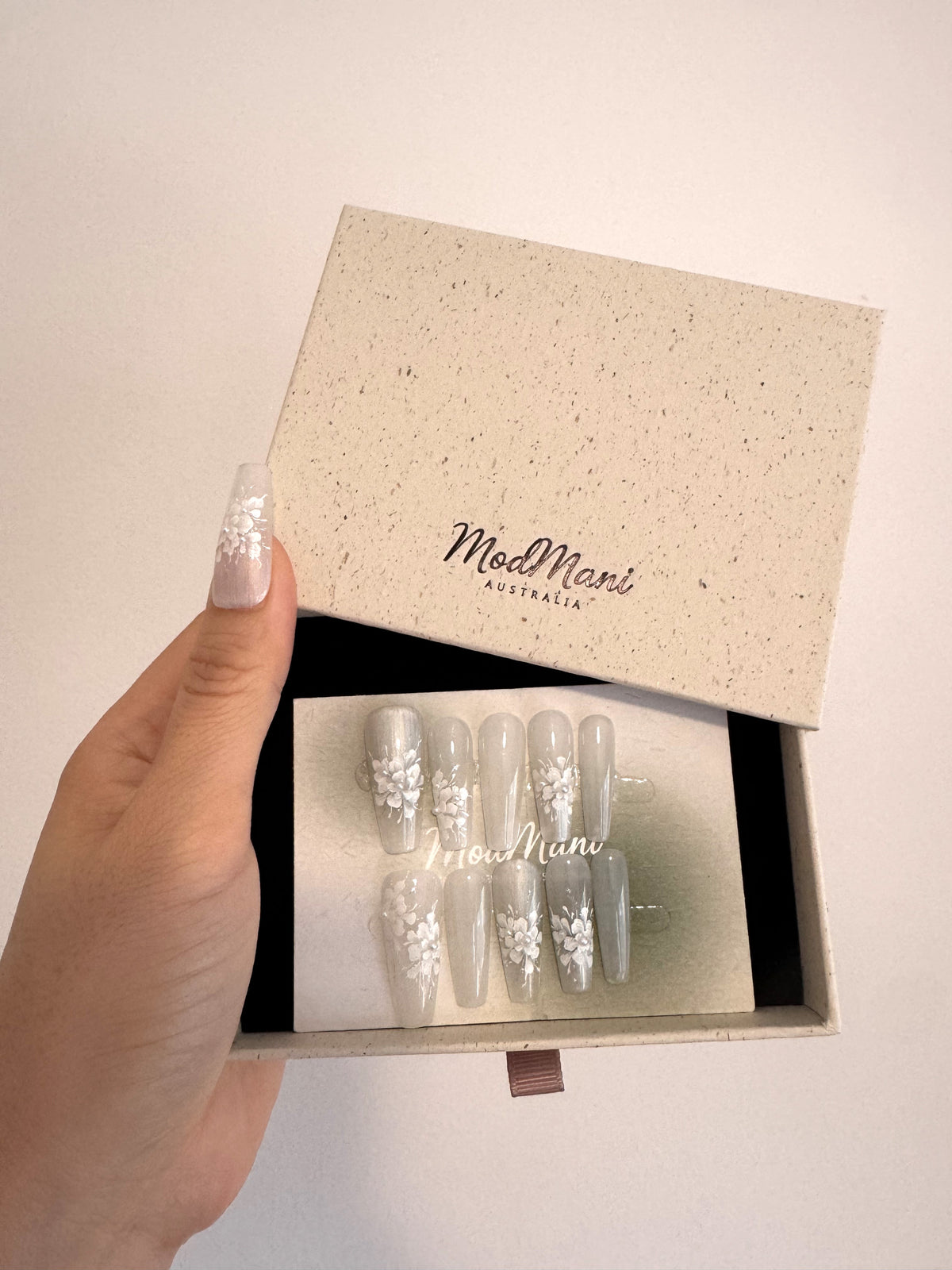Pearl Bloom hand-painted floral press-on nails in premium ModMani presentation box 1
