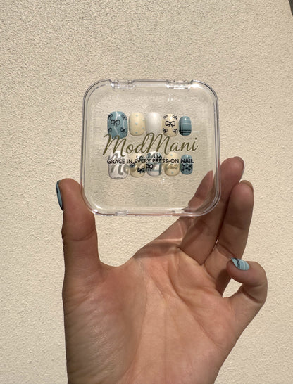 Petite Ribbon ModMani press-on nails held in natural Gold Coast sunlight