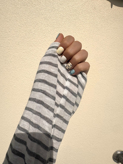 Petite Ribbon Extra Short Squoval press-on nails worn on hand